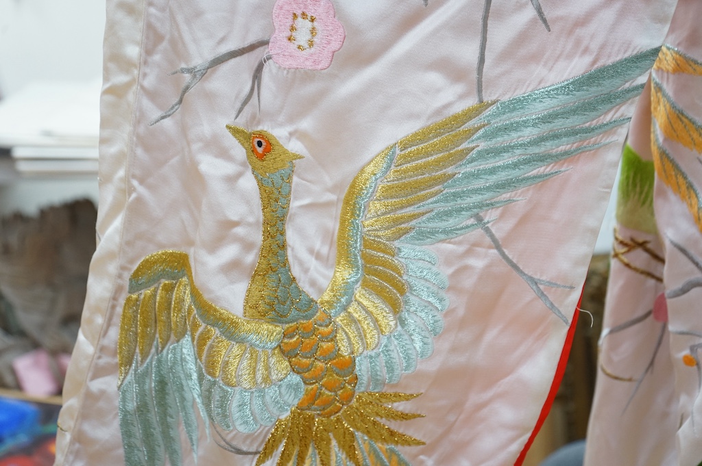 A late 20th century polychrome silk and metallic embroidered Japanese kimono, 133cm long. Condition - the silk is stained in places, which may be able to be cleaned.